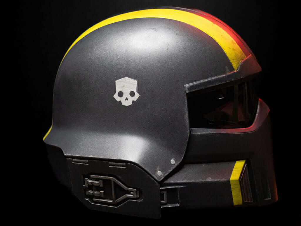 Helldivers Helmet side profile black Super Earth infantry helmet with yellow accent stripe